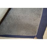 An approx 6'6" x 4'5" grey rug