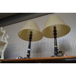 A pair of blue painted table lamps and shades
