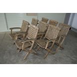 Eight teak folding garden chairs