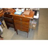 An Edwardian mahogany music cabinet