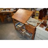 A pine desk fitted two drawers