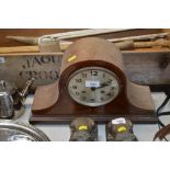 A mahogany and inlaid cased two hole mantel clock