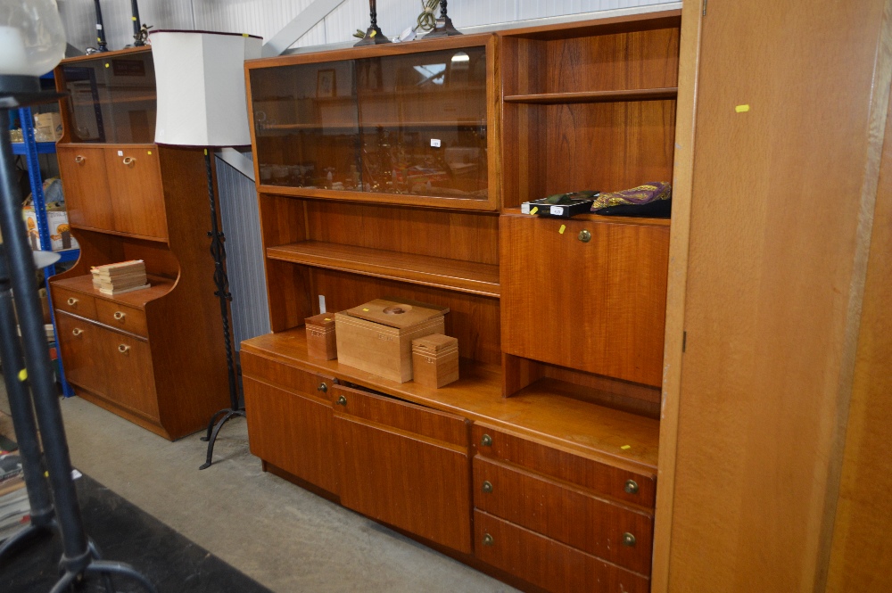 A Mackintosh teak wall unit fitted three drawers