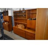 A Mackintosh teak wall unit fitted three drawers