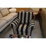 A striped upholstered armchair