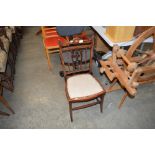 An Edwardian mahogany bedroom chair