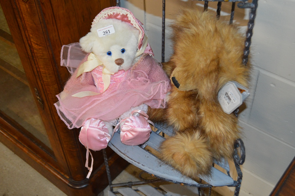 A Suki teddy bear and an Ashton Drake teddy bear
