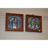 A pair of wooden framed glazed tiles each depictin