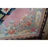 An approx. 5 10 x 4 wool floral decorated rug