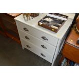 A grey painted chest fitted three long drawers