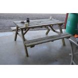 A teak garden picnic bench