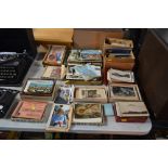 A large quantity of various postcards, photographs