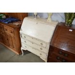 A white painted bureau fitted three drawers