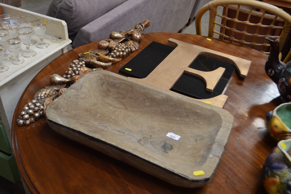 A dug out bowl; granite chopping board; hanging wa