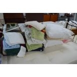 A large quantity of various towels, blankets, cush