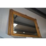 A gilt framed bevel edged wall mirror