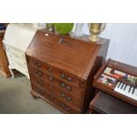 A Georgian mahogany bureau fitted four long drawer