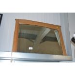 A bevel edged wall mirror