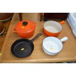 A quantity of Le Creuset style cooking dishes