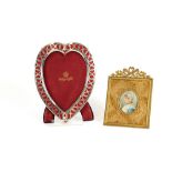A silver heart shaped photograph frame, by Mappin & Webb, London 1894; and a miniature portrait on