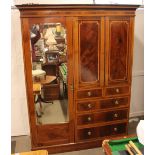 An Edwardian mahogany and satinwood cross-banded combination wardrobe, hanging compartment