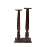 A 19th Century mahogany fluted torchere stand, raised on square plinth; and another similar with