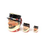 A set of three Royal Doulton graduated Beefeater character jugs