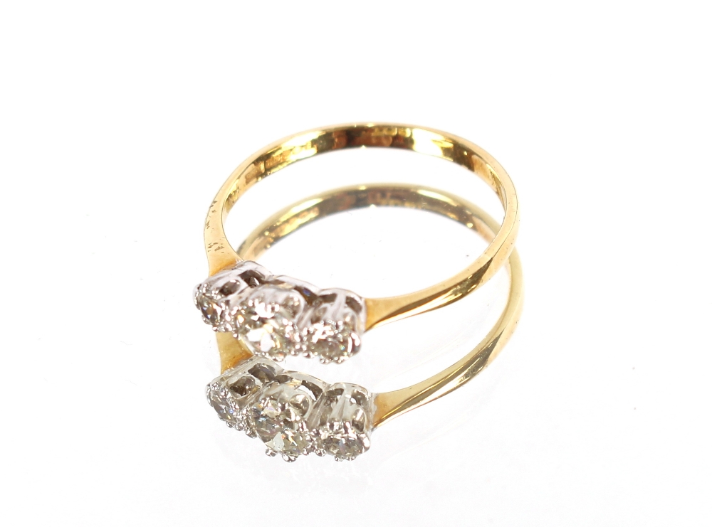 A three stone diamond 18 carat gold ring
