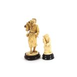 An Antique carved Japanese ivory sectional figure of a street vendor, on circular base, AF; and an