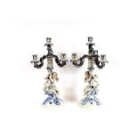 A pair of 19th Century Dresden cherub decorated candelabra, 44cm high, AF