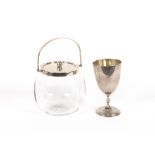 A glass and silver mounted biscuit barrel; and a Continental white metal goblet, (2)