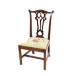 A pair of mahogany Chippendale style dining chairs, having pierced splat backs, upholstered drop-