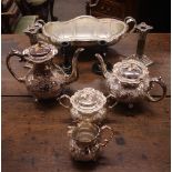 A four piece plated tea/coffee set, by John Turton; a large oval plated fruit bowl; a pair of plated