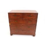 A 19th Century teak and brass bound military chest, fitted two short and three long drawers, in