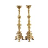 A pair of large gilt metal ecclesiastical candlesticks, in the 17th Century Venetian style, raised