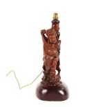 An Oriental carved hardwood figural table lamp, 50cm high overall