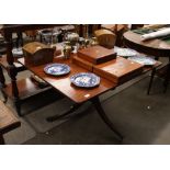 A 19th Century mahogany snap top supper table, the rectangular top raised on a turned baluster