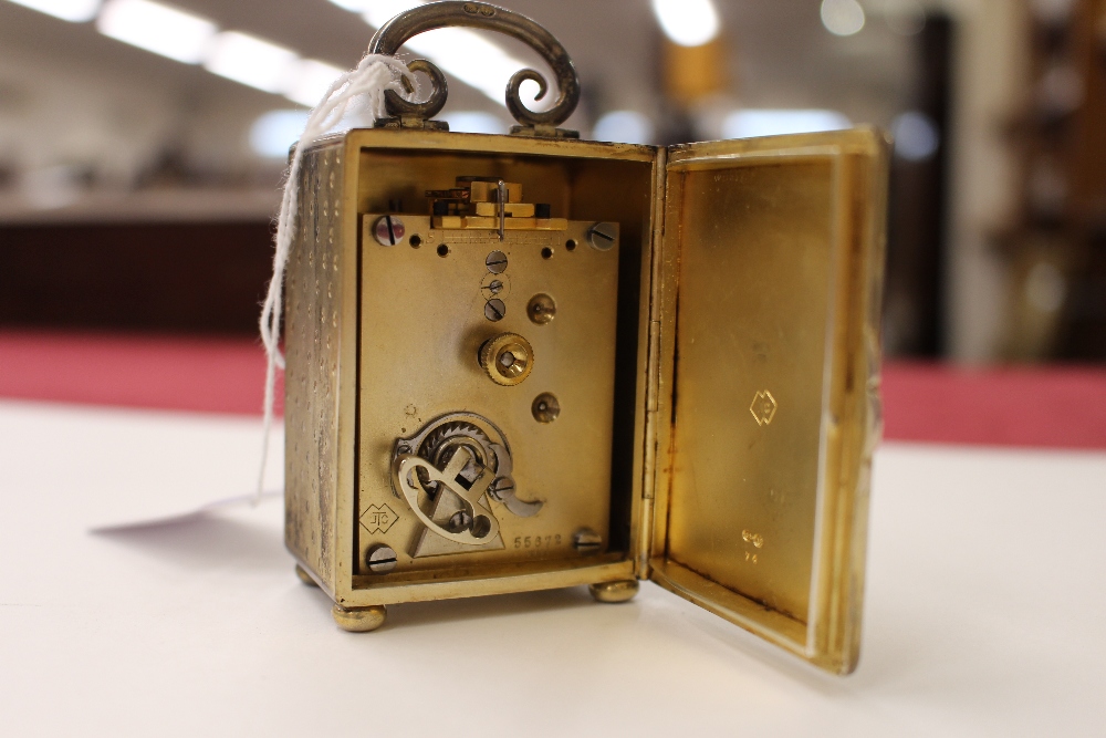 A miniature silver gilt carriage clock, contained in a leather folding travelling case - Image 4 of 5