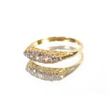 An 18 carat gold old cut boat shaped diamond cluster ring