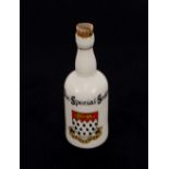A collection of numerous crested china bottles, including Shelley, Carlton and Arcadian examples,