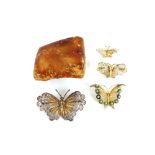 Four filigree butterfly brooches; together with a large piece of amber, approx. 2½ozs.