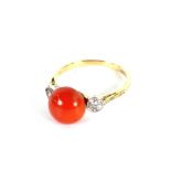 An 18 carat gold coral and diamond set ring