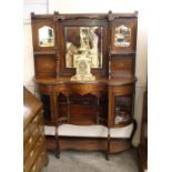 A late Victorian rosewood chiffonier, having raised mirrored back, bow fronted base with curved
