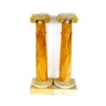 A pair of decorative marblised and painted classical columns, 119cm high