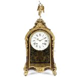 A 19th Century tortoiseshell and cut brass and ormolu inlaid French mantel clock, surmounted by a