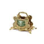 An early 20th Century ormolu letter rack, in the rococo taste, with two green enamel panels, 15cm