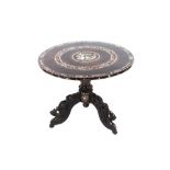 An Oriental hardwood and mother of pearl inlaid circular occasional table, profusely decorated