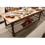 An Antique oak refectory table, raised on turned baluster supports united by stretchers, 90cm x