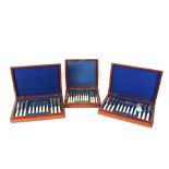 Two Victorian mahogany cased sets of fish knives and forks; and a cased set of 12 each plated