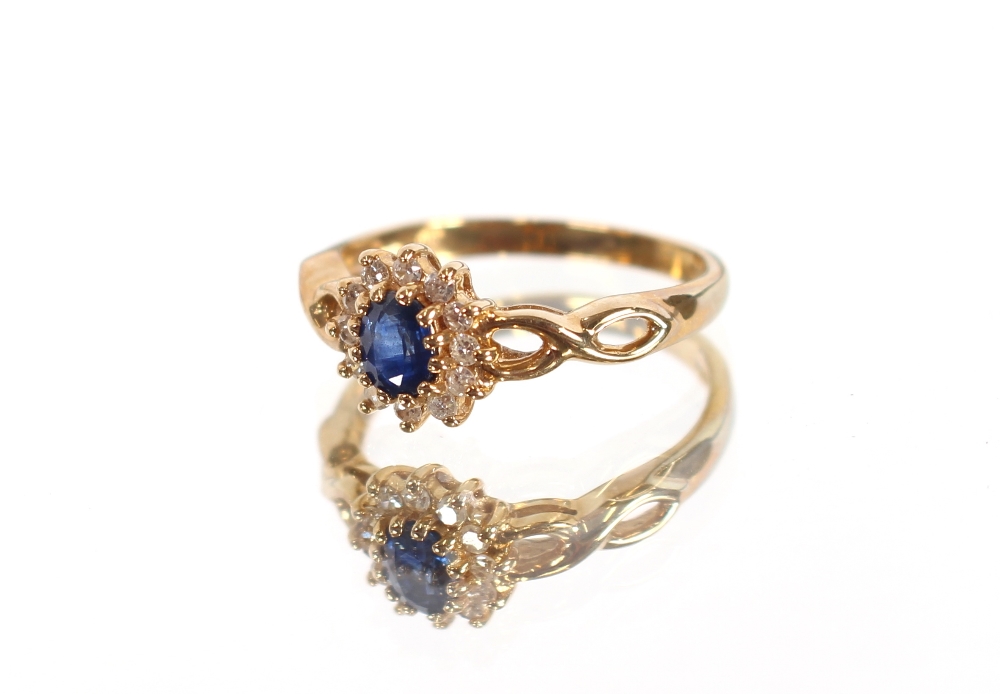 A 9 carat gold sapphire and diamond ring